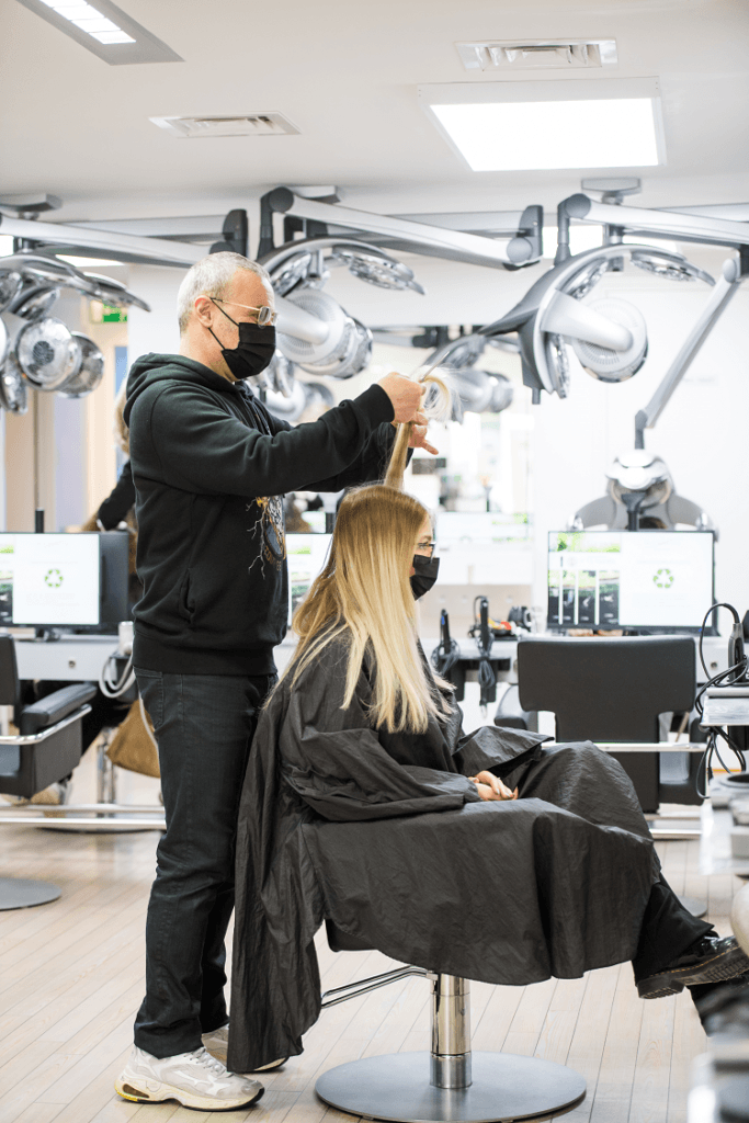 Hair designer Ayt Celik in his hair salon Hair4U in Zaandam
